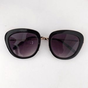 Black sunglasses with gold hardware